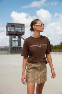 TRENDYOLMİLLA Brown 100% Cotton Slogan Printed relaxed/Wide Relaxed Cut Knitting T-Shirt