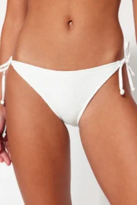 TRENDYOLMİLLA White tied up textured Regular Bikini Bottom - Image 5
