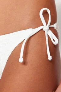 TRENDYOLMİLLA White tied up textured Regular Bikini Bottom - Image 6
