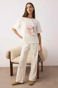 TRENDYOLMİLLA Ecru 100% Cotton Ribbon and Star Printed Knitting Pajama Set