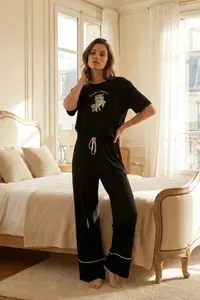 TRENDYOLMİLLA Black 100% Cotton Fun Printed Bias Detailed Knitting Pajama Set - Image 2